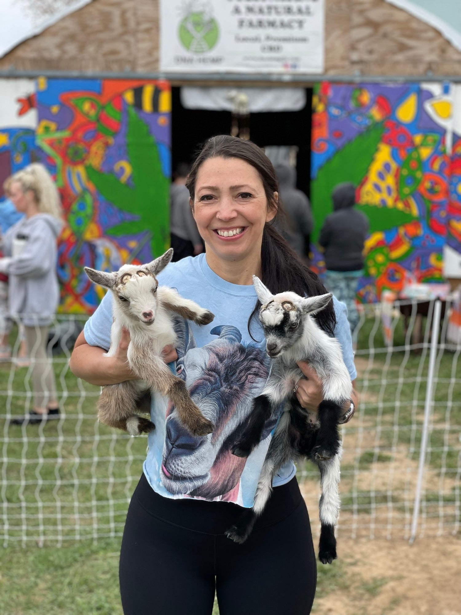 Fela from Blue Luna Yoga and Wellness holding baby goats