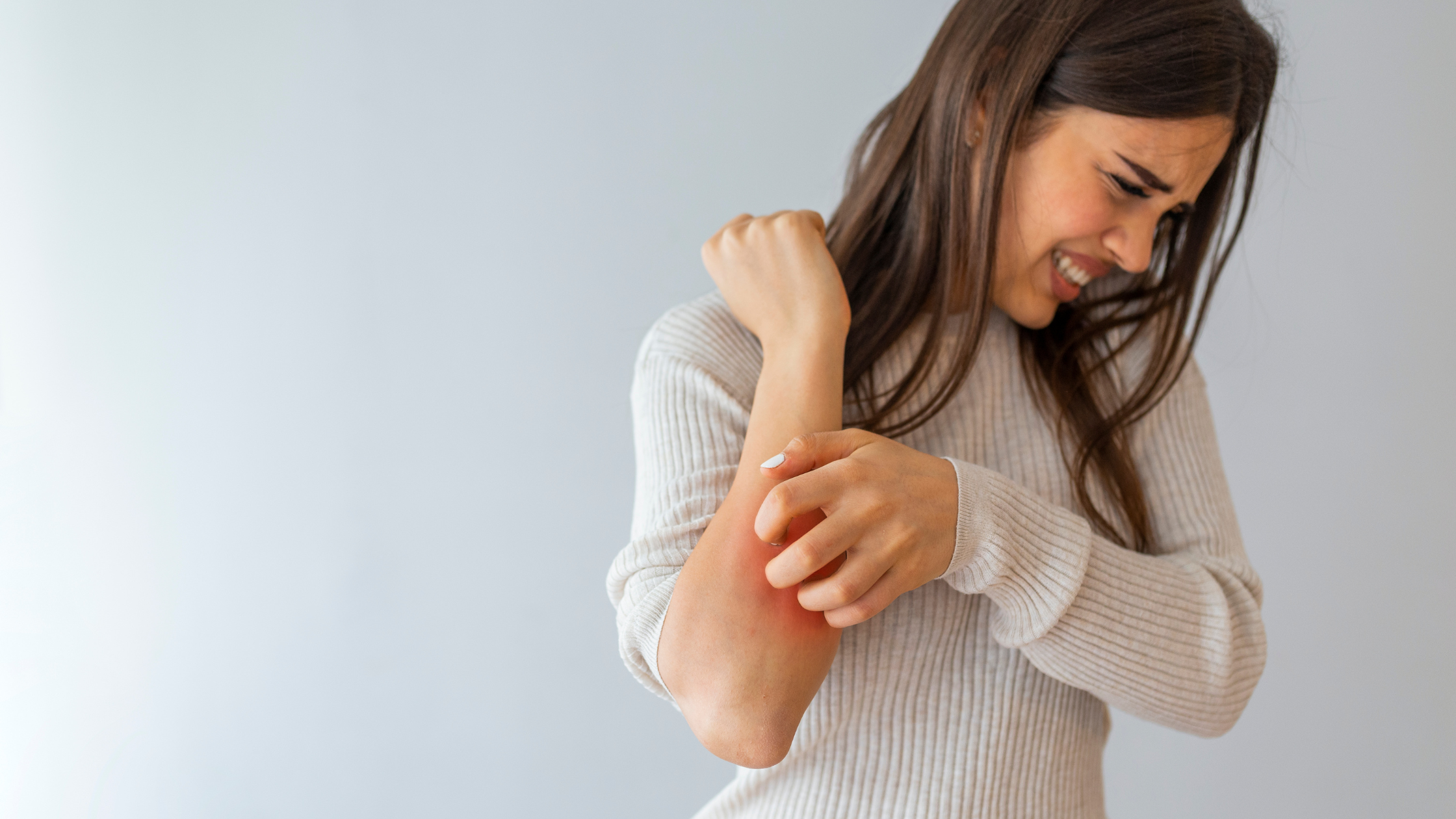 Women reacting to irritated sensitive skin